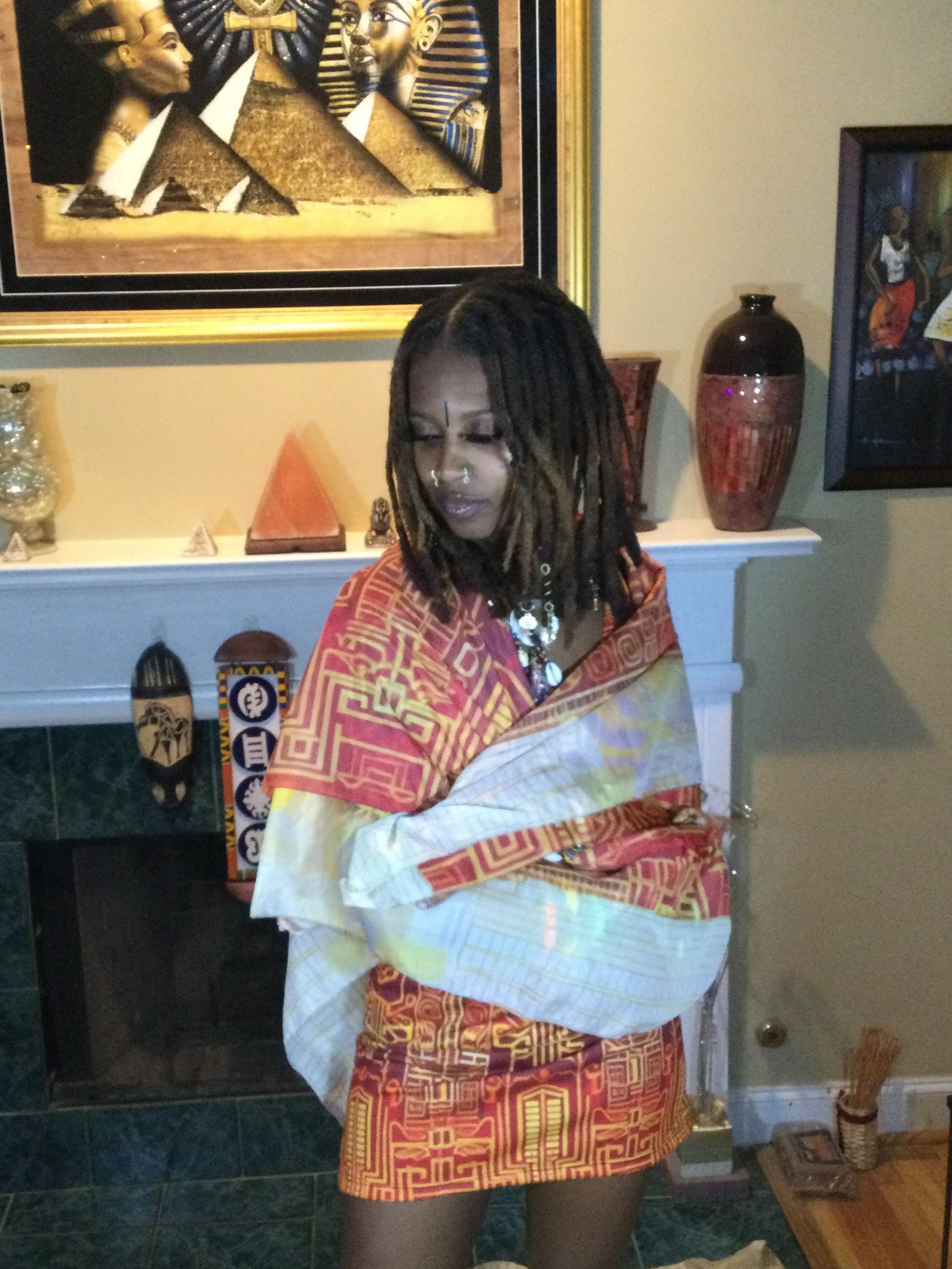 Black Woman with Locs Wrapped in a Beautiful Futuristic Kente Print Scarf