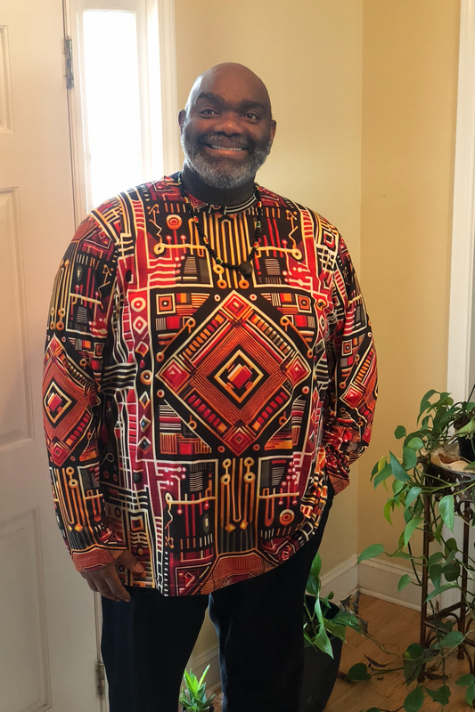 Black Male Wearing a Black History Month Afrofuturism Kente Cloth Design in Alicia McCalla's Storefront