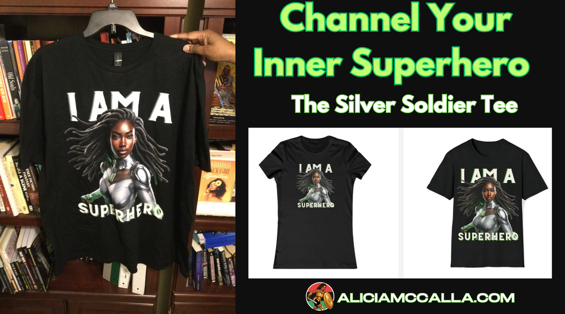 Alicia McCalla's hand holding the sample of the Silver Soldier T-shirt on a Hanger featuring a Dark Skin Black woman with locs on this Black Nerd Shirt.