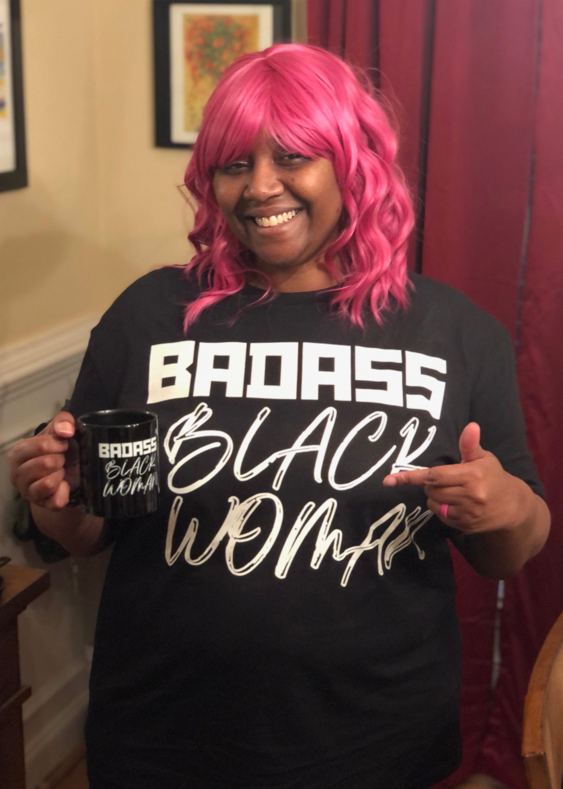 Author Alicia McCalla wearing Badass Black Woman T-Shirt and Holding Mug Available at her Shopify store 